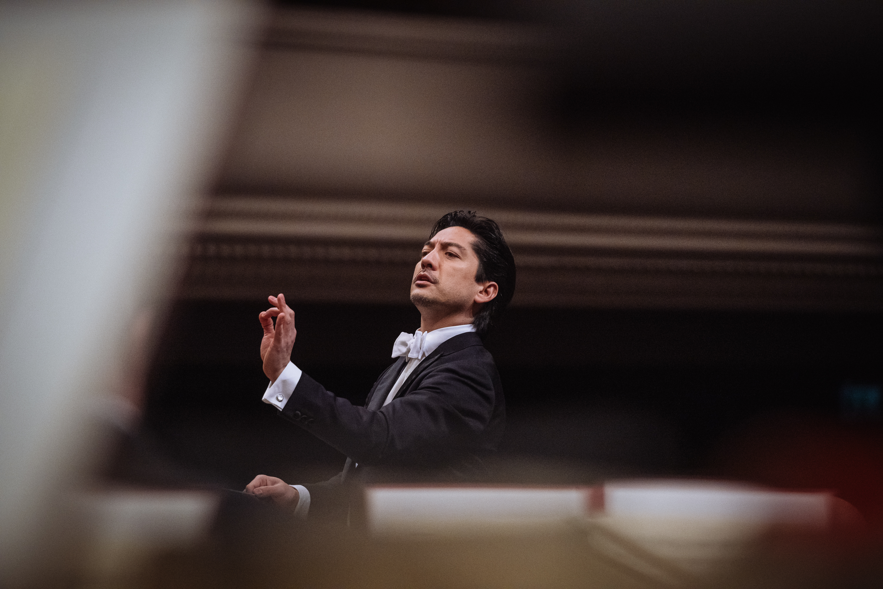 Eugene Tzigane conducting